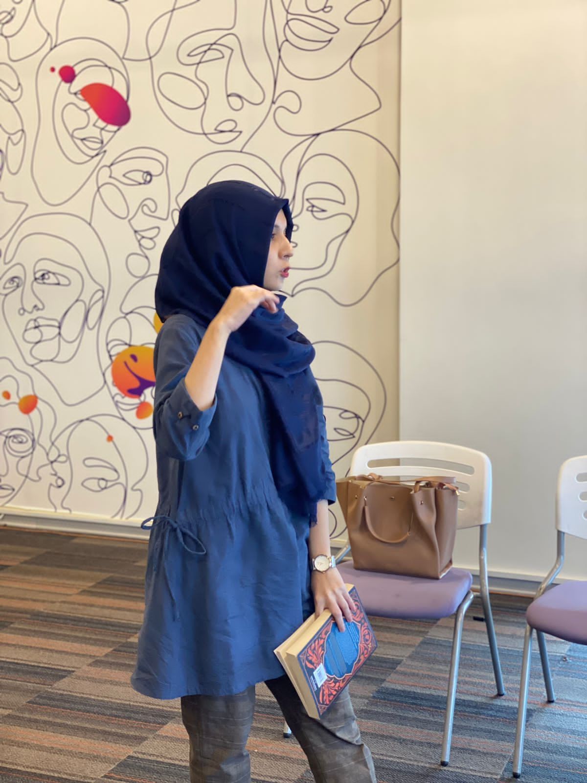 Maha facilitating a discussion during a workshop session