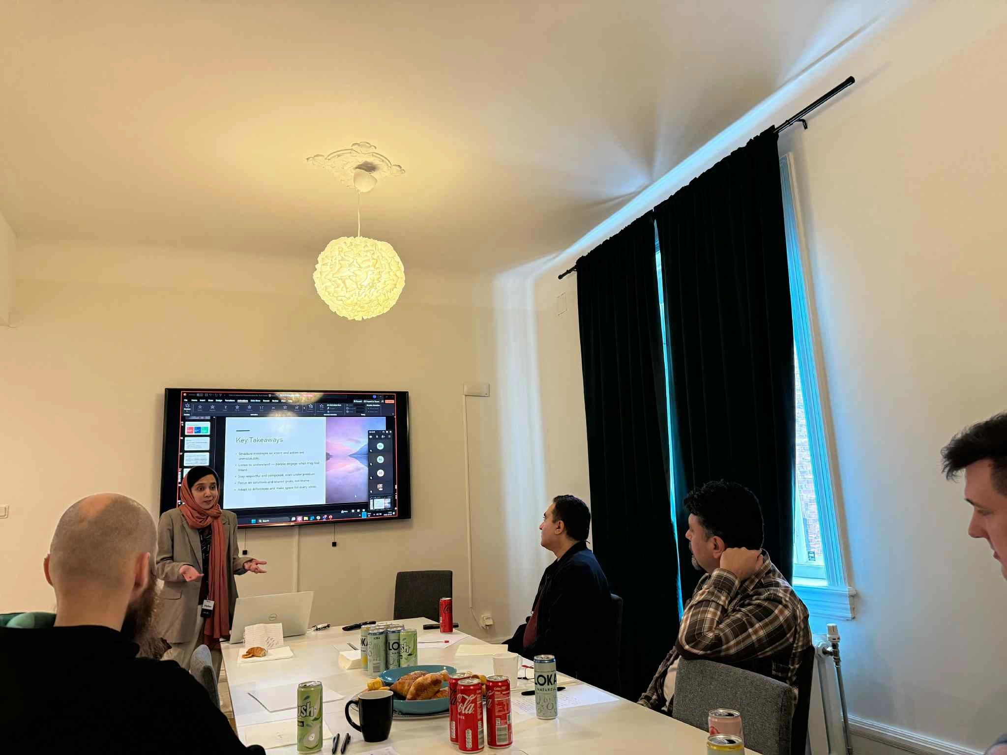 Maha leading a workplace communication training session